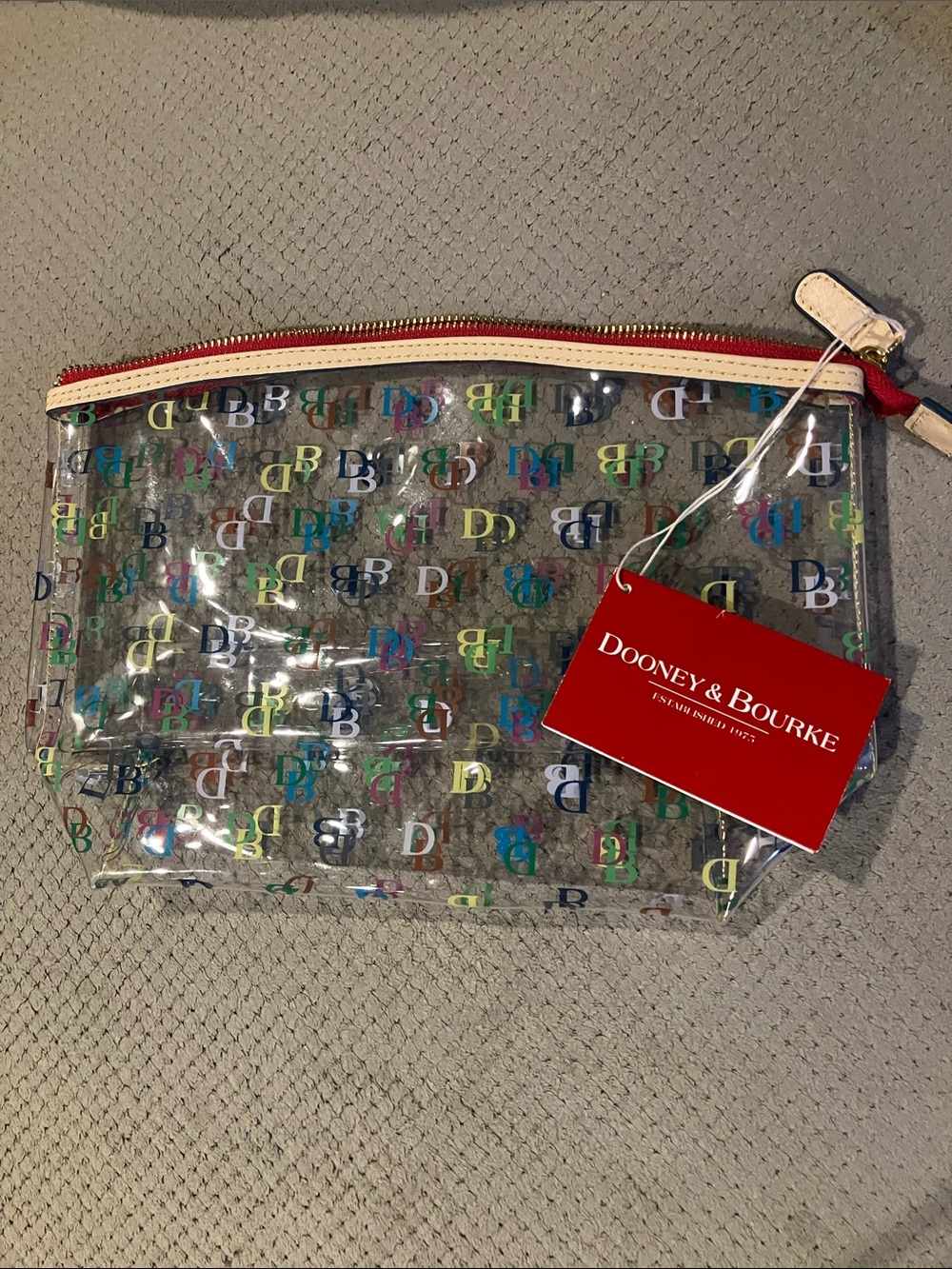 Dooney & Bourke Clear Pouch with Multicolor DB Print and Red Trim